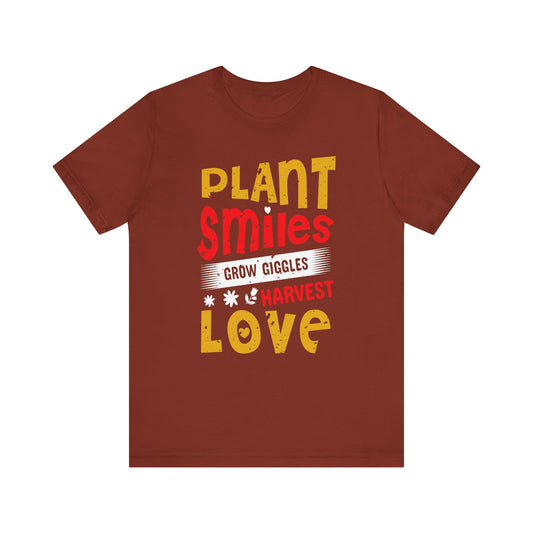 Plant Smiles, Grow Giggles, Harvest Love Tee – Wholesome Farmcore Graphic Shirt for Women| Unisex Jersey Short Sleeve Tee